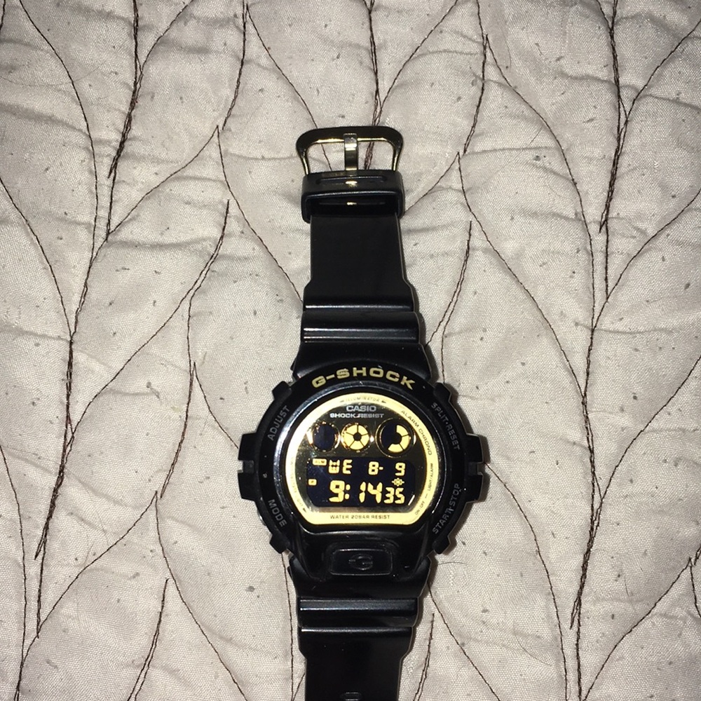 Gently used authentic g shock black gold